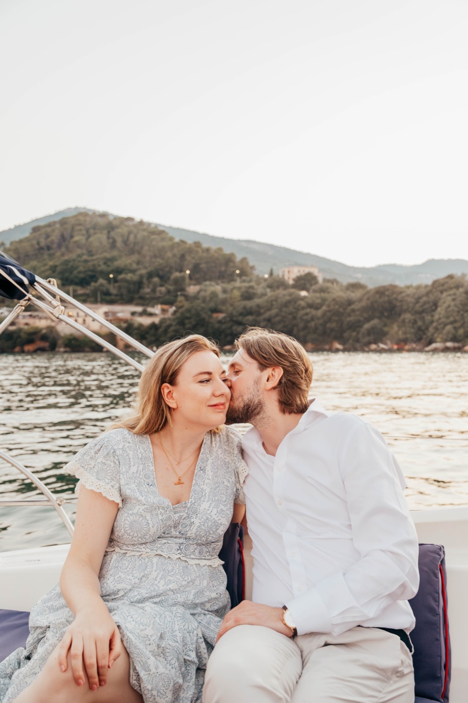 A kiss on the cheek in the golden evening light aboard the boat